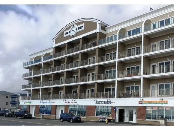 a building with cars parked in front of it.