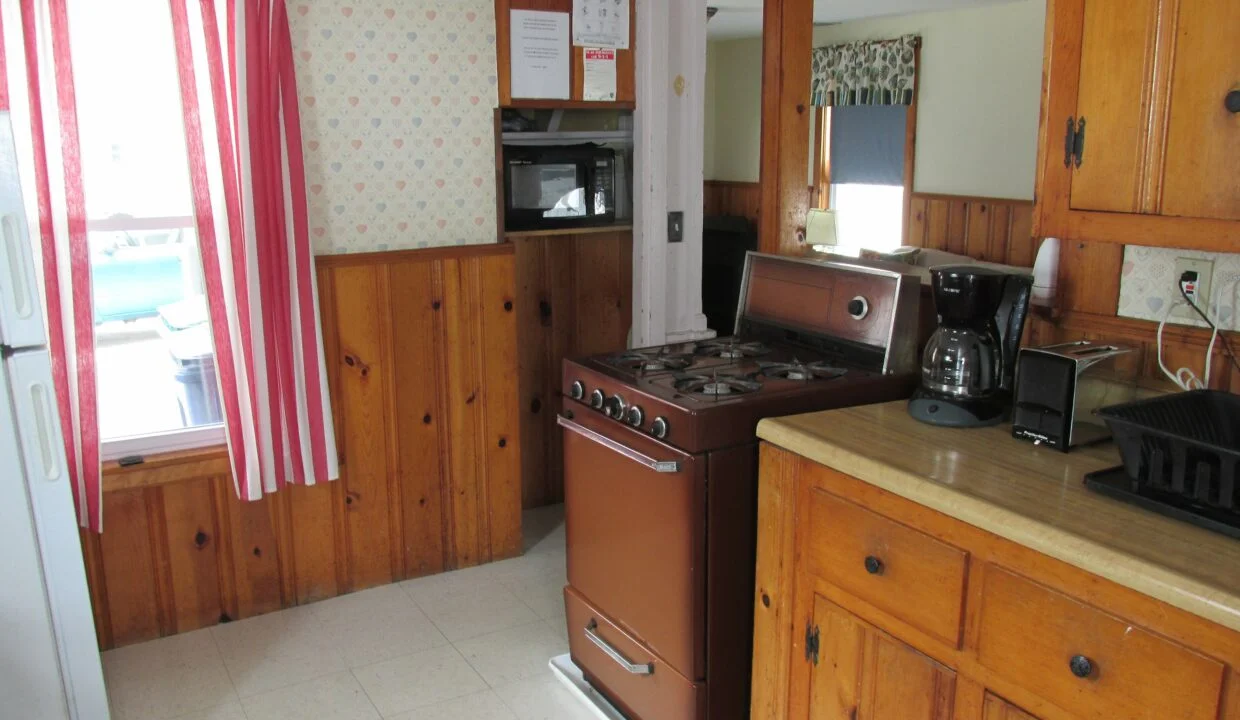 a kitchen with a stove and a refrigerator.