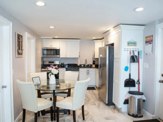 a kitchen with a table and chairs in it.