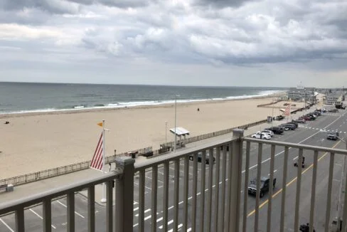 a view of a beach from a balcony.