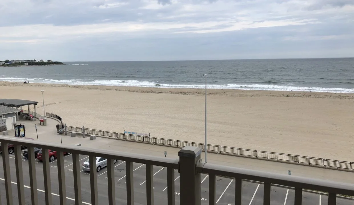 a view of the beach from a balcony.