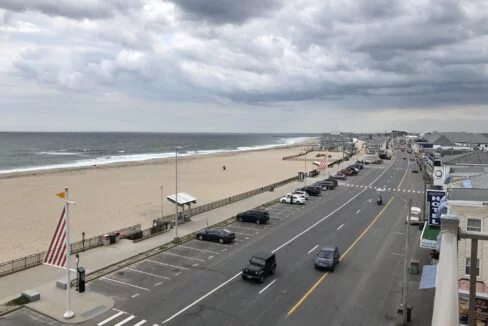 a view of a beach from a balcony of a hotel.