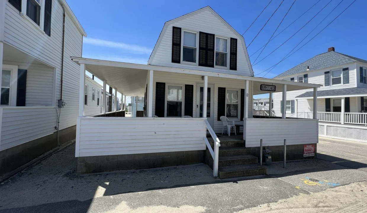 a couple of white houses sitting next to each other.