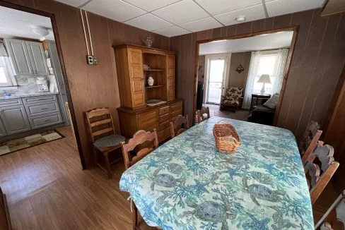 a dining room table with a basket on top of it.