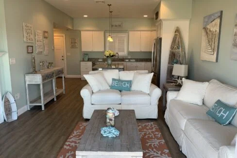 a living room filled with furniture and a coffee table.