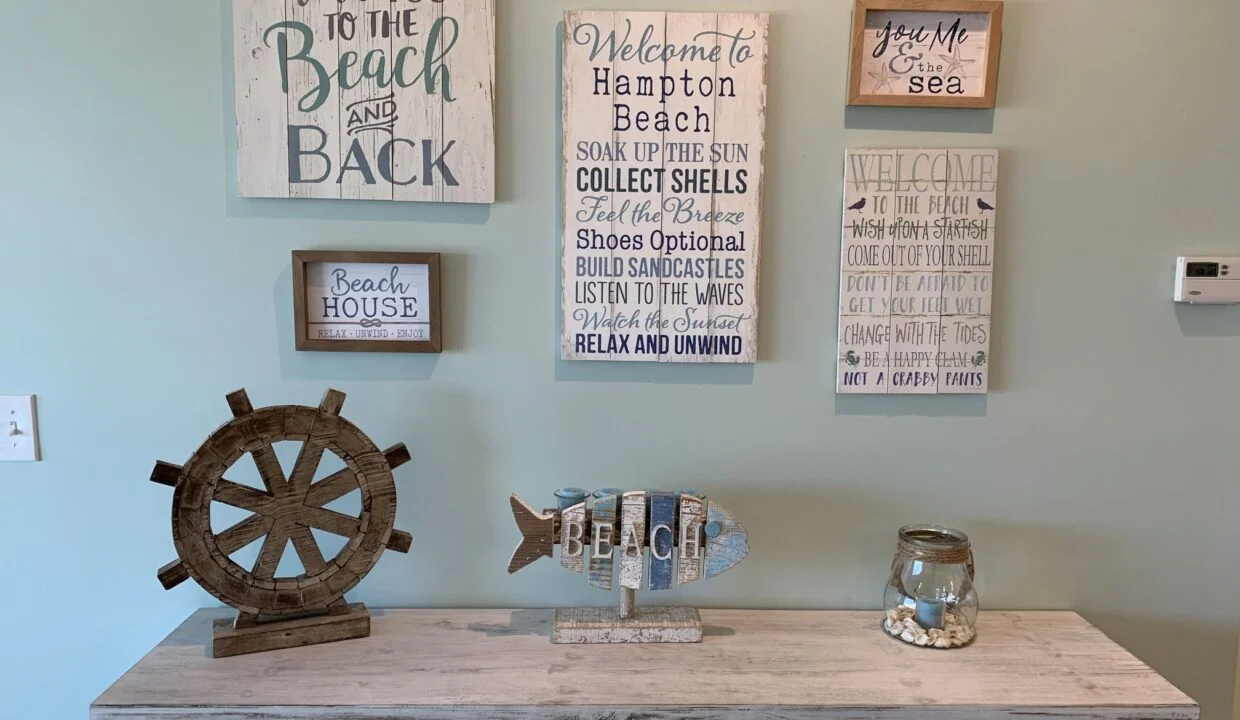 a room with a dresser and a clock on the wall.