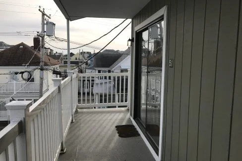 a balcony with a view of a city.