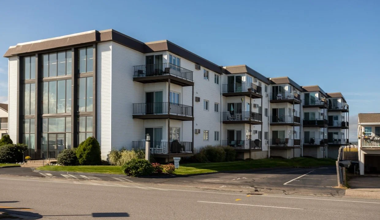 an apartment building with balconies and balconies on the second floor.