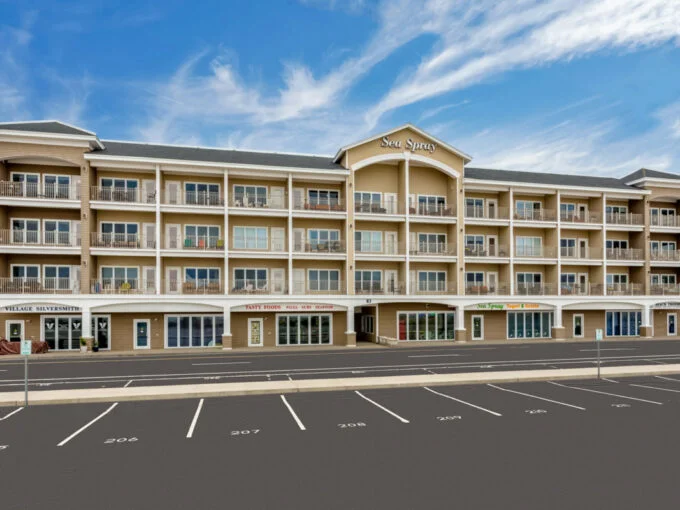 an empty parking lot in front of a hotel.