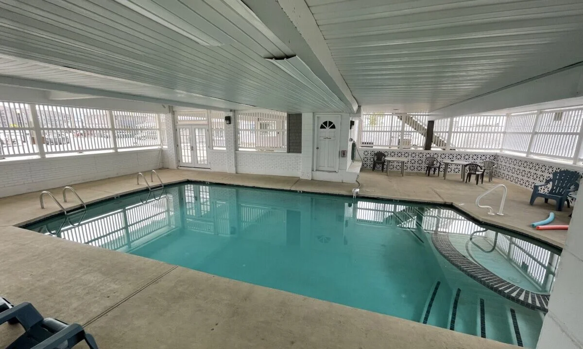 a large indoor swimming pool in a building.