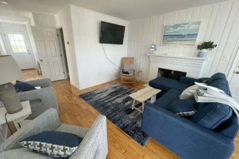 a living room filled with furniture and a flat screen tv.