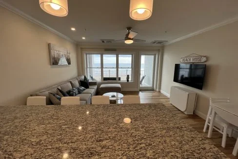 a living room with a couch a table and a tv.