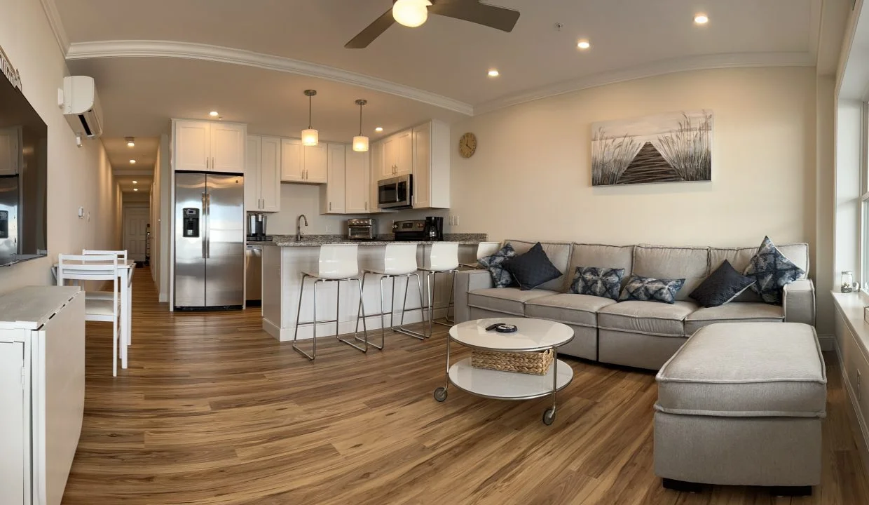 a living room filled with furniture and a flat screen tv.