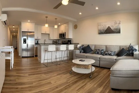 a living room filled with furniture and a flat screen tv.