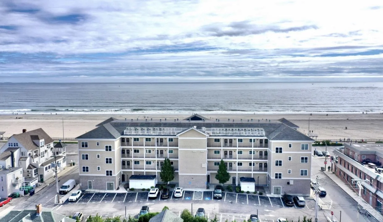 An aerial view of an apartment complex near the beach.