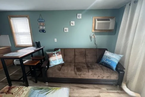 a living room with a couch and a table.