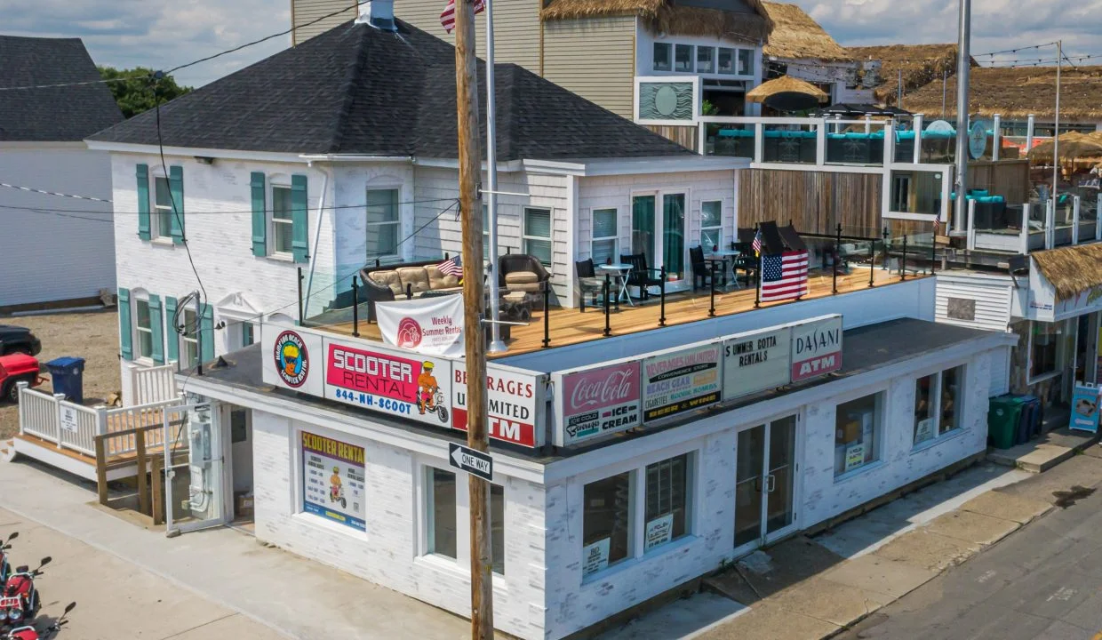 a white building with a flag on top of it.