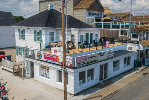 a white building with a flag on top of it.