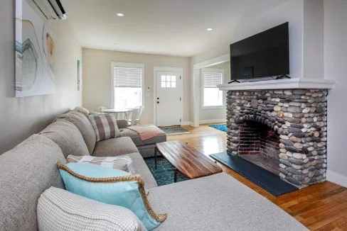 a living room with a fire place and a couch.