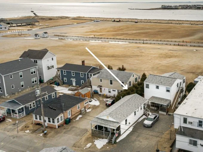 an aerial view of several houses in a neighborhood.