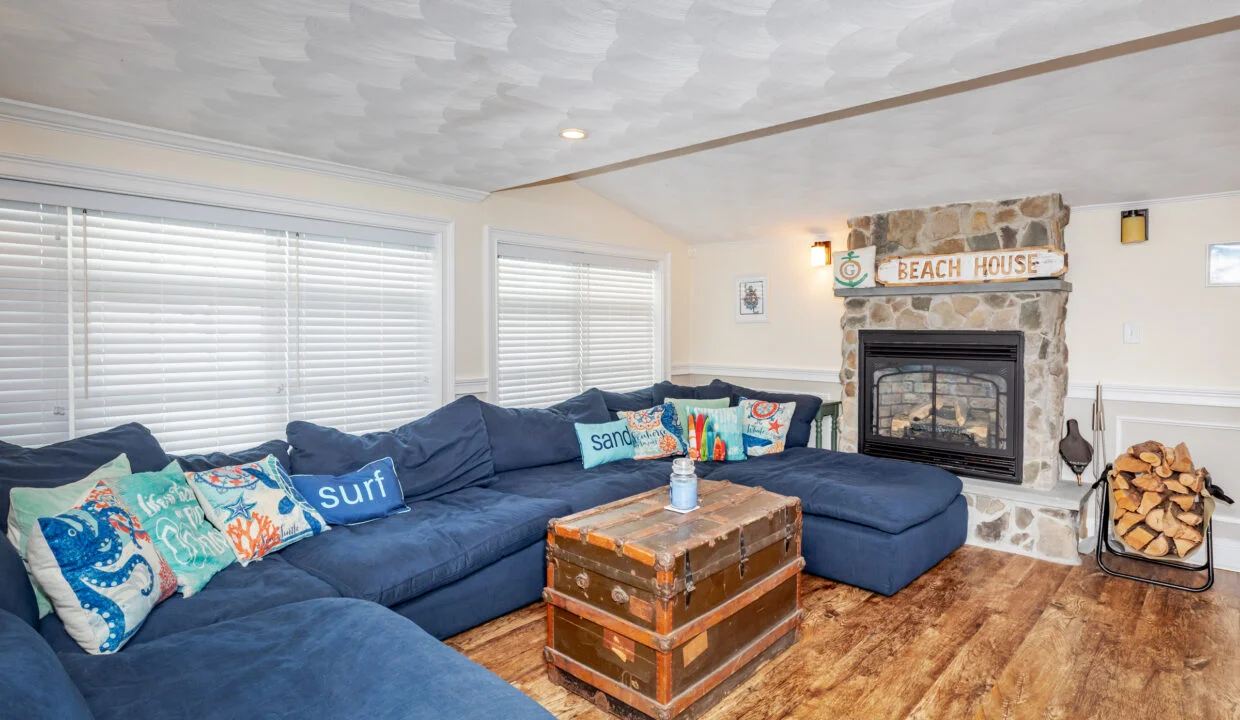 a living room filled with furniture and a fire place.