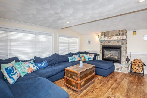 a living room filled with furniture and a fire place.