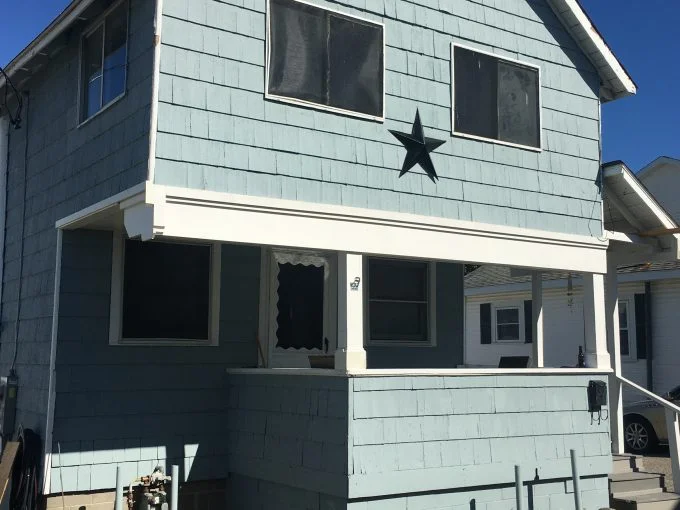 A blue house with a star on it.